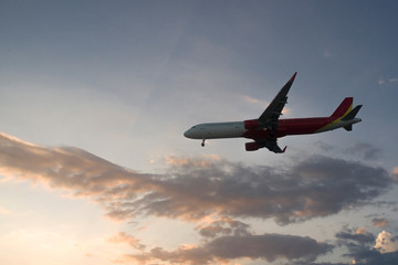  plane at sunset is landing