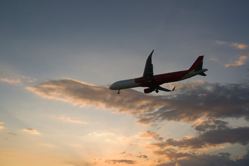  plane at sunset is landing