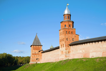Fototapeta na wymiar Two ancient towers (Kokui and Pokrovskaya) on a sunny October day. Kremlin of Veliky Novgorod