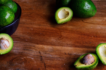 Delicious avocados on an old table