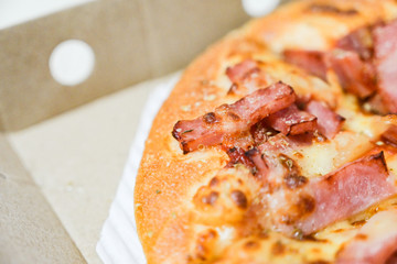 Close up of hawaiian pizza with boiled ham and pineapple.