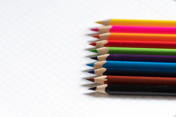 Fototapeta premium colored pencils on the notebook