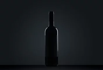 Keuken foto achterwand bottle of wine on black background © Alex