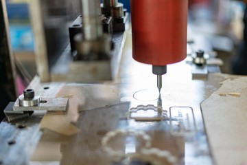 DIY Mini CNC Machine for 3D carving. Process of 3D cutting, machining and sculpting. Cutting 3D text on the workpiece