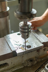 Drilling machine in factory workshop