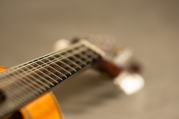  Mandolin in flashlight on gray background.