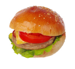 Hamburger with meat, cheese, tomato and salad. Isolated on white