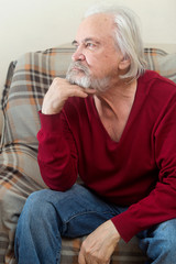 The old man in the armchair at home