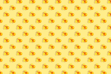 Oranges on bright colored yellow background. Repeating pattern, preparation for wallpaper citrus mood.