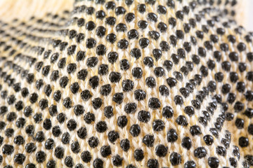 an oven glove macro shot showing the black protection dots made out of plastic