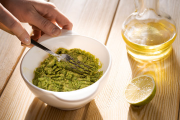 Cooking traditional latin american mexican sauce guacamole