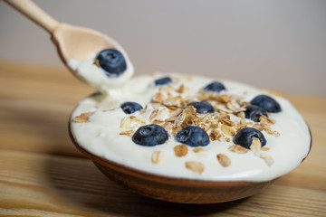 Healthy breakfast. Yogurt with granola and blueberry