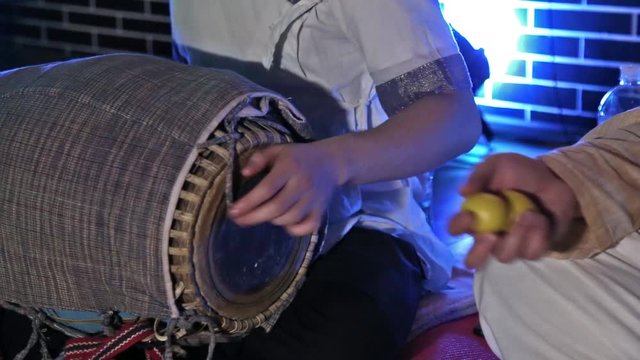 Hare Krishna Man Playing Traditional Indian Instrument Mridanga Close-up.
