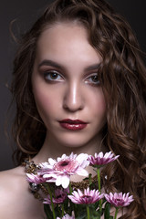 Naklejka premium Portrait of a beautiful teen girl with creative makeup.