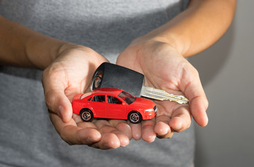 Fototapeta premium Car toy and key in hand.