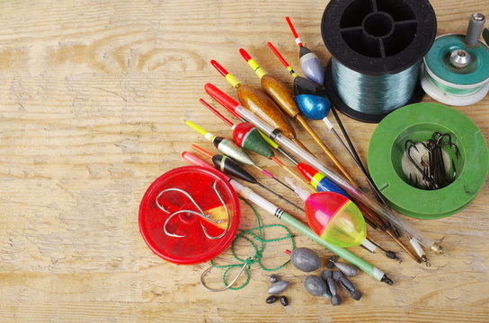 Fishing floats and fishing gear on a wooden table.