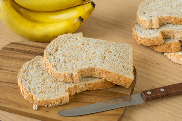 Wheat breads with banana on board.
