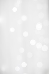 Blur photo of White christmas background with bokeh lights and snowflakes © NVB Stocker