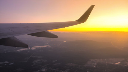 Sunset time Above the clouds.Wing aircraft on the sky