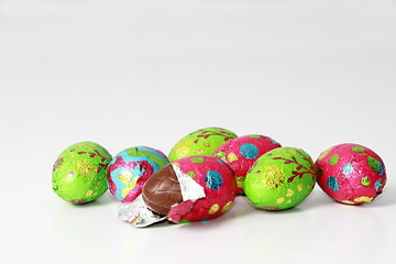 painted chocolate Easter eggs on table