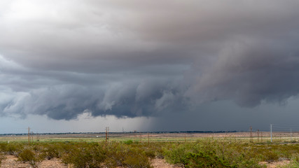 Dark Cloudy Sky with Rain Showers in the Countryside Farmland