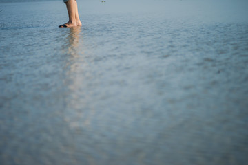 Abstract of water surface and human leg on the sea