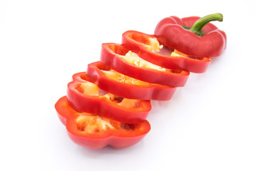 Set of sliced  red bell pepper section pieces isolated over white background, view above