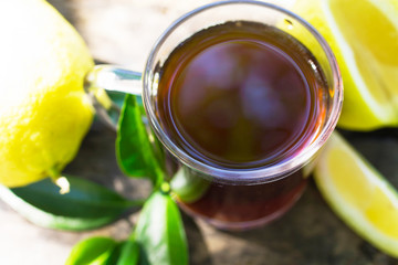 hot red tea cup with lemon