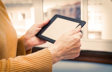 woman's hands working with digital tablet