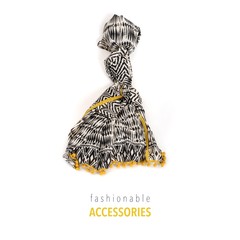 Beautiful scarf with geometric black and white pattern and yellow tassels isolated on a white background for framing labels, announcements and pictures