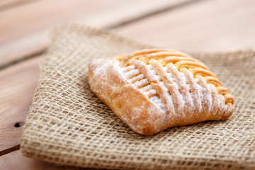 Cake with cottage cheese on canvas on a wooden table