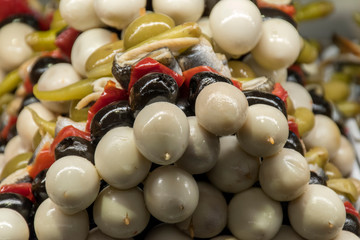 Close up, skewer of olives with garnish