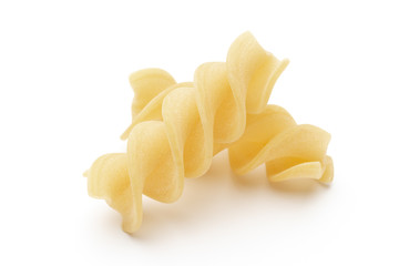 Italian twisted pasta fusilli isolated on white background. Fusilloni, rotini.
