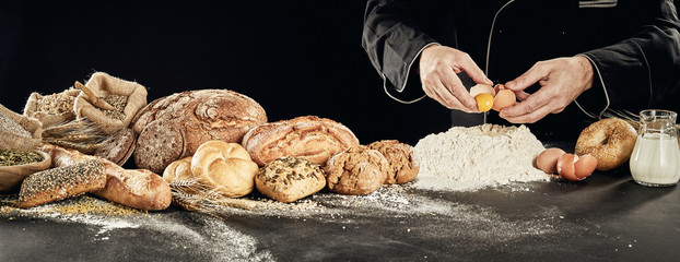 Panorama of chef preparing speciality bread loaves