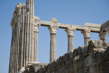 Fototapeta premium Roman ruins of columns against the blue sky.