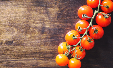 Fototapeta na wymiar Branch with fresh cherry tomatoes. Ripe red tomatoes.