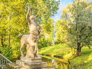 Old park sculpture centaur on  bridge in park