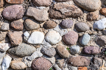 Old garden wall bricks. Stones in the wall, walling texture. Different types of bricks, Roman brick wall - Image