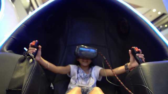 Kid playing with virtual reality glasses 