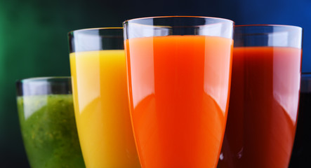 Glasses with fresh organic vegetable and fruit juices