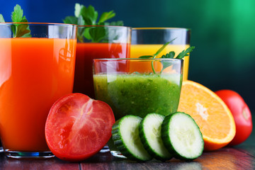 Glasses with fresh organic vegetable and fruit juices