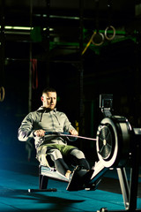 Workout on the rowing machines at the gym © Inna Vlasova