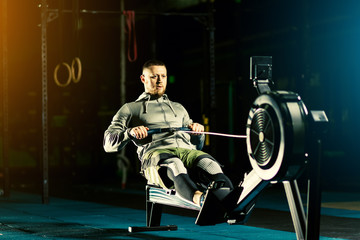Workout on the rowing machines at the gym © Inna Vlasova