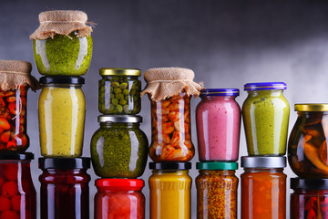 Jars with variety of pickled vegetables and fruits