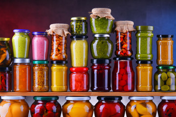 Jars with variety of pickled vegetables and fruits