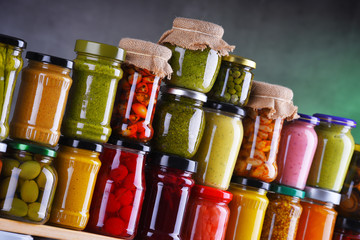 Jars with variety of pickled vegetables and fruits