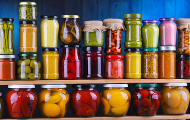 Jars with variety of pickled vegetables and fruits