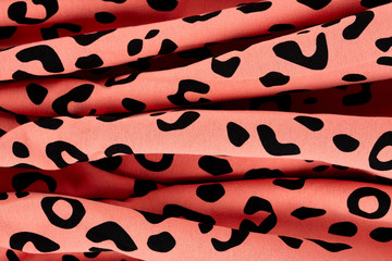 Cotton fabric with animal print. Animal pattern background or texture. Texture leopard.