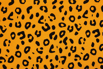 Cotton fabric with animal print. Animal pattern background or texture. Texture leopard.