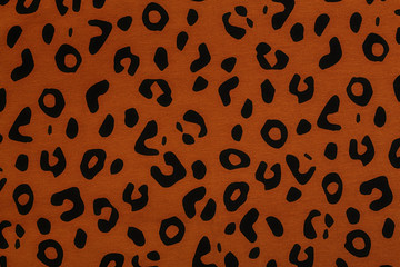 Cotton fabric with animal print. Animal pattern background or texture. Texture leopard.